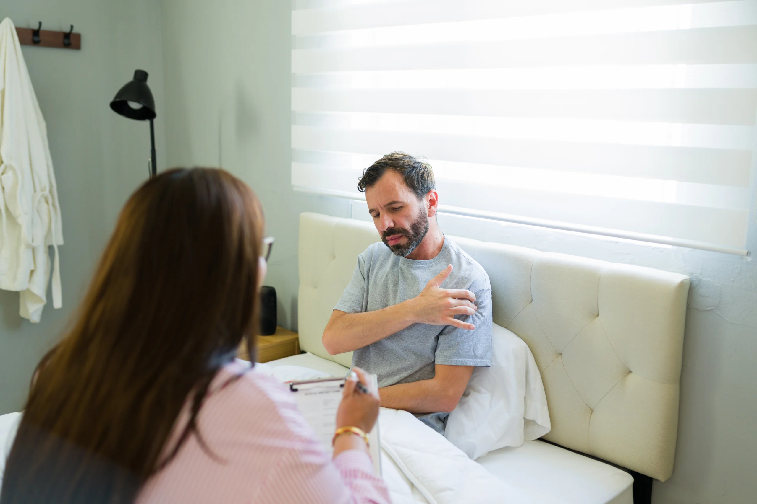 A patient experiencing rotator cuff tear symptoms. They discuss with their surgeon about diagnosis and treatment options.