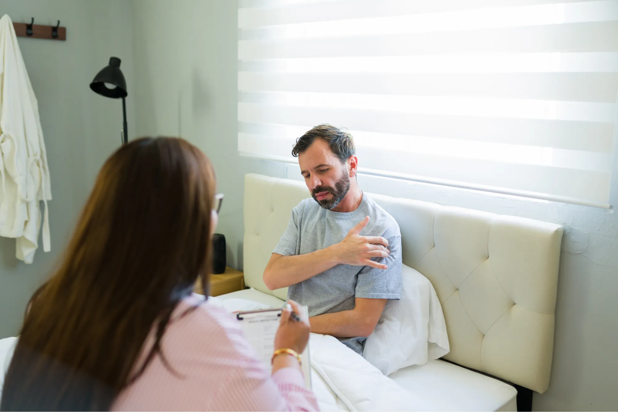 A patient experiencing rotator cuff tear symptoms. They discuss with their surgeon about diagnosis and treatment options.