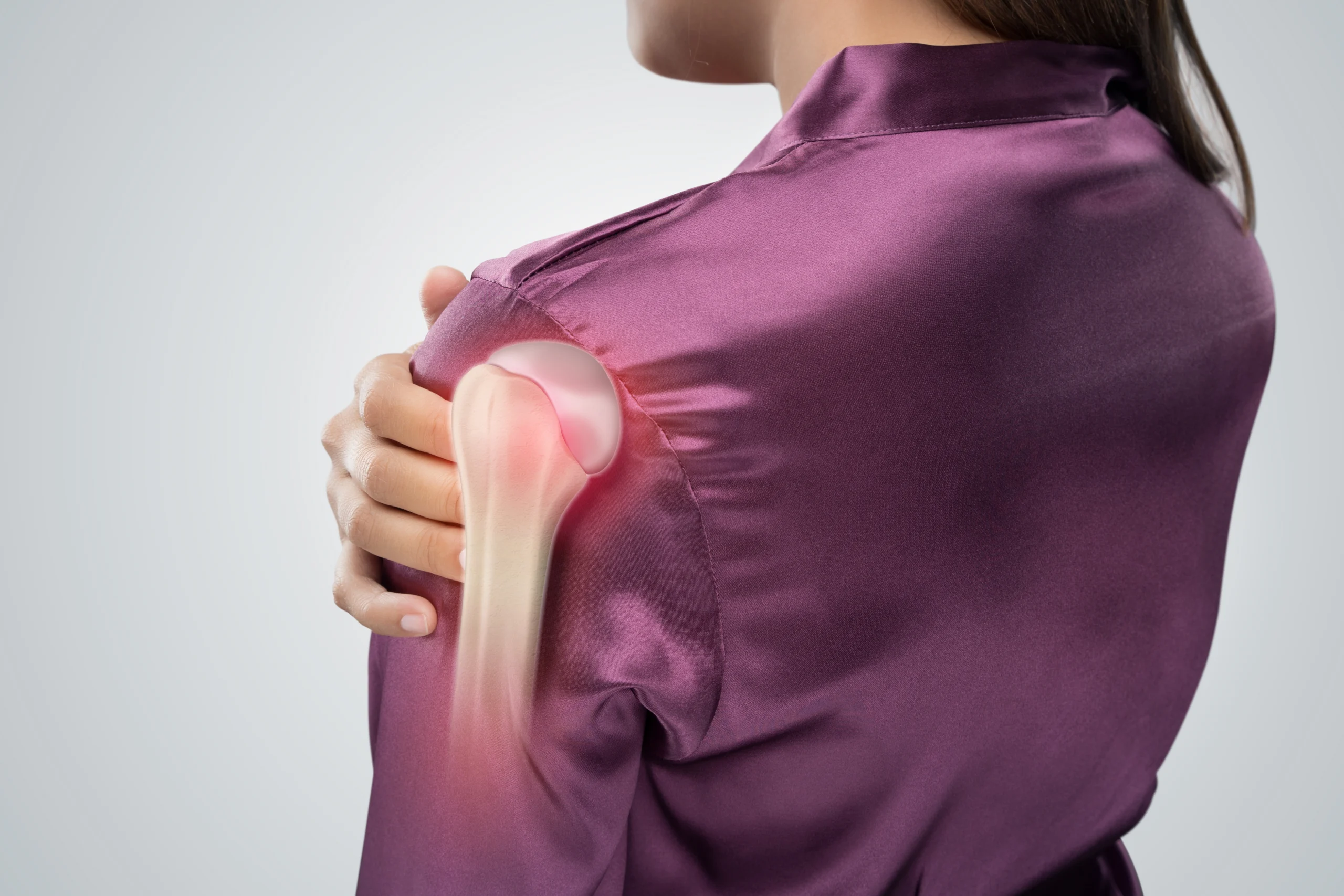 woman with a frozen shoulder, exploring the causes and treatment options.