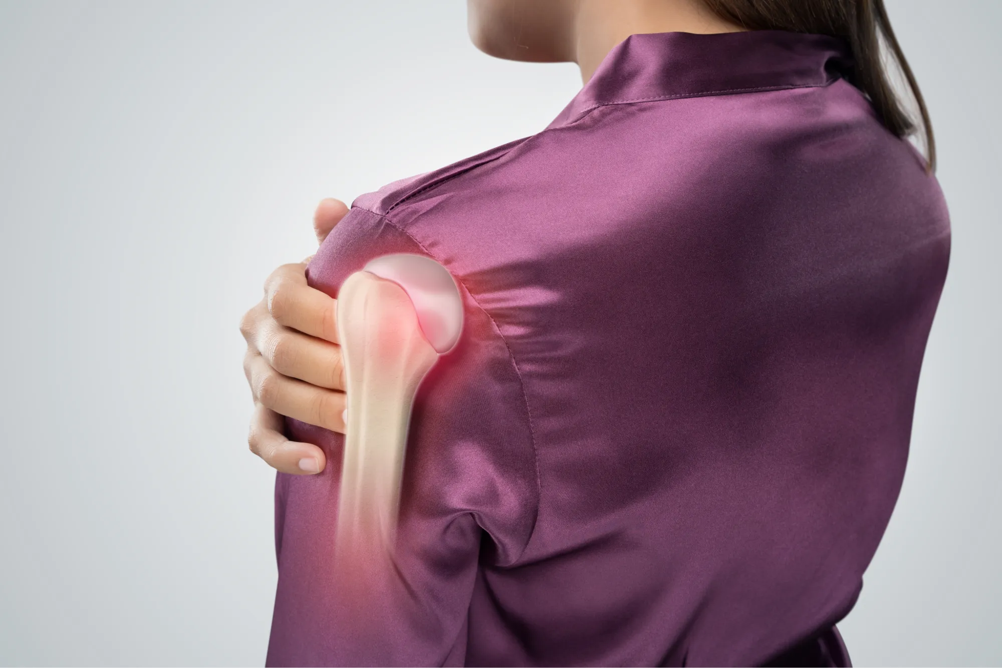 woman with a frozen shoulder, exploring the causes and treatment options.